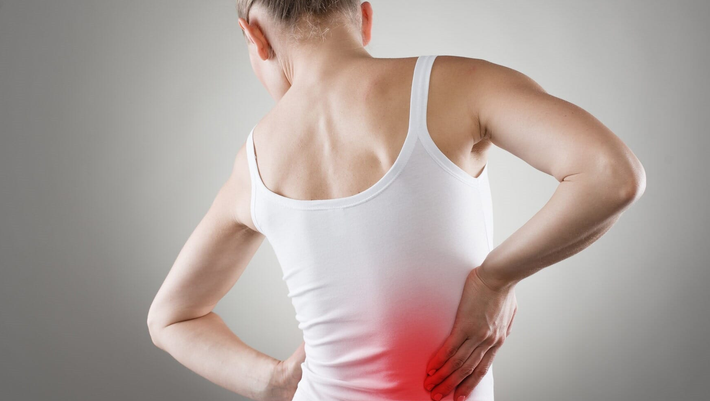 Woman with back pain — Nutrition in White River Junction, VT