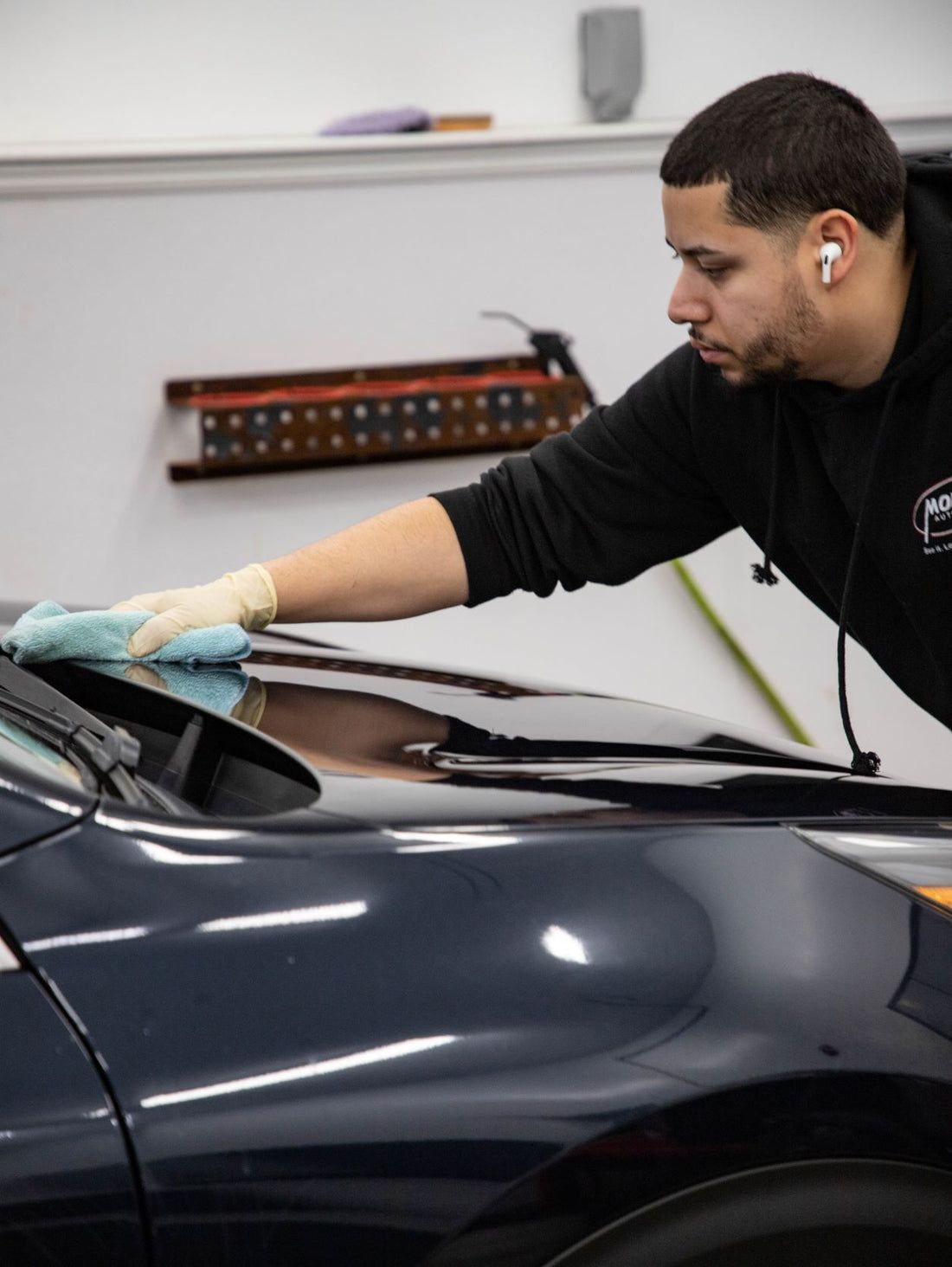 Mechanic installing Ceramic coating | Modern Auto Care 
