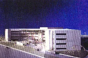 A large building with a blue sky in the background