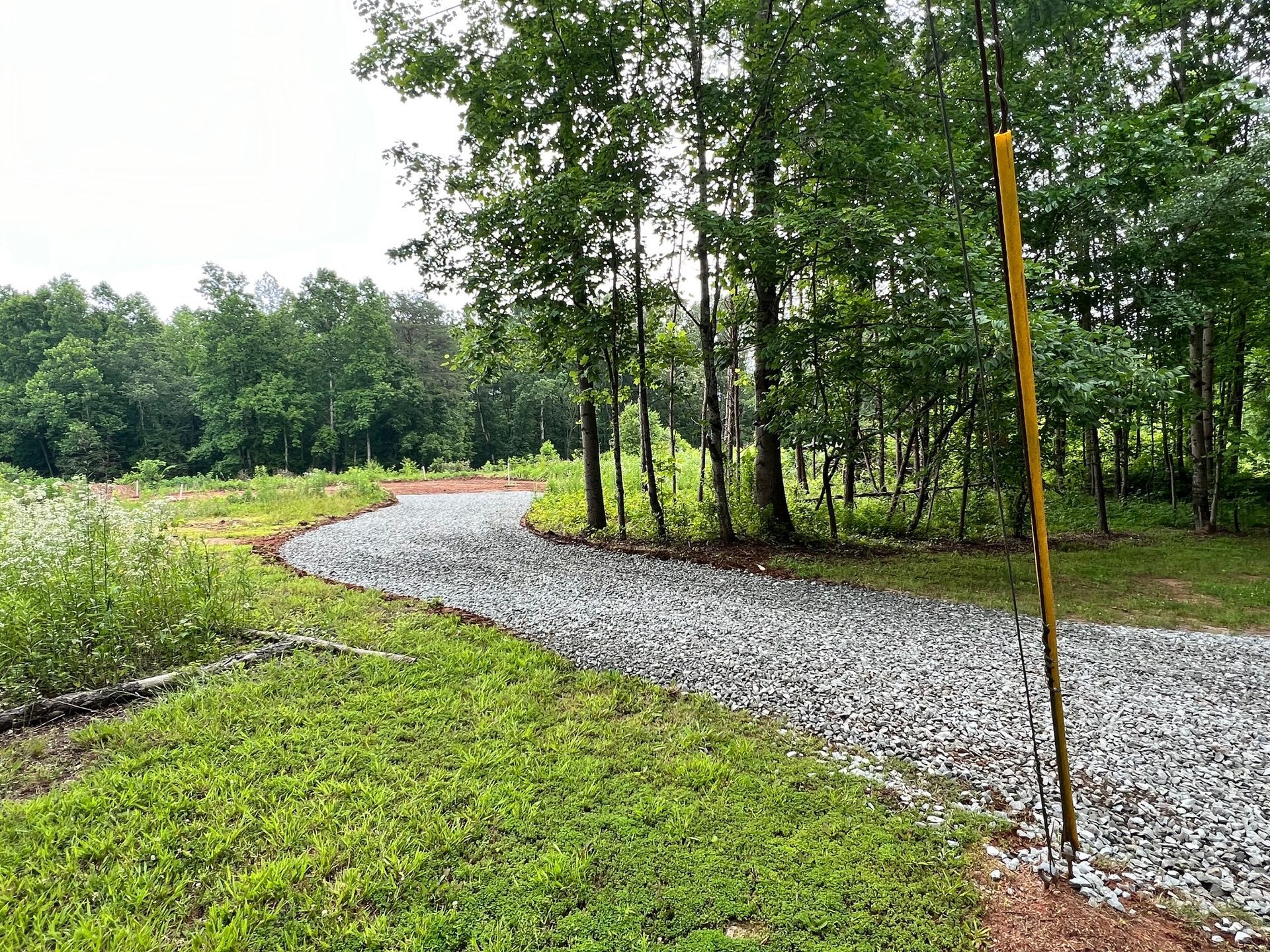 Driveway with Grass and Trees Surround - Jamestown, NC - Piedmont Site Works