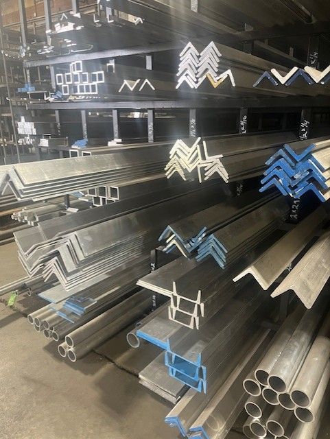 A bunch of metal pieces are stacked on top of each other on a table.