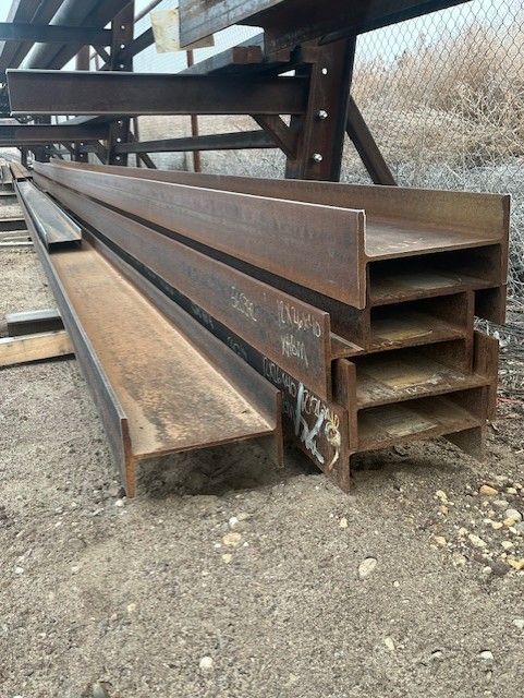 A bunch of metal pieces are stacked on top of each other on a table.