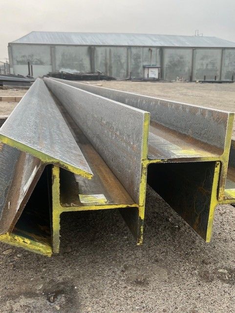 A bunch of metal pieces are stacked on top of each other on a table.