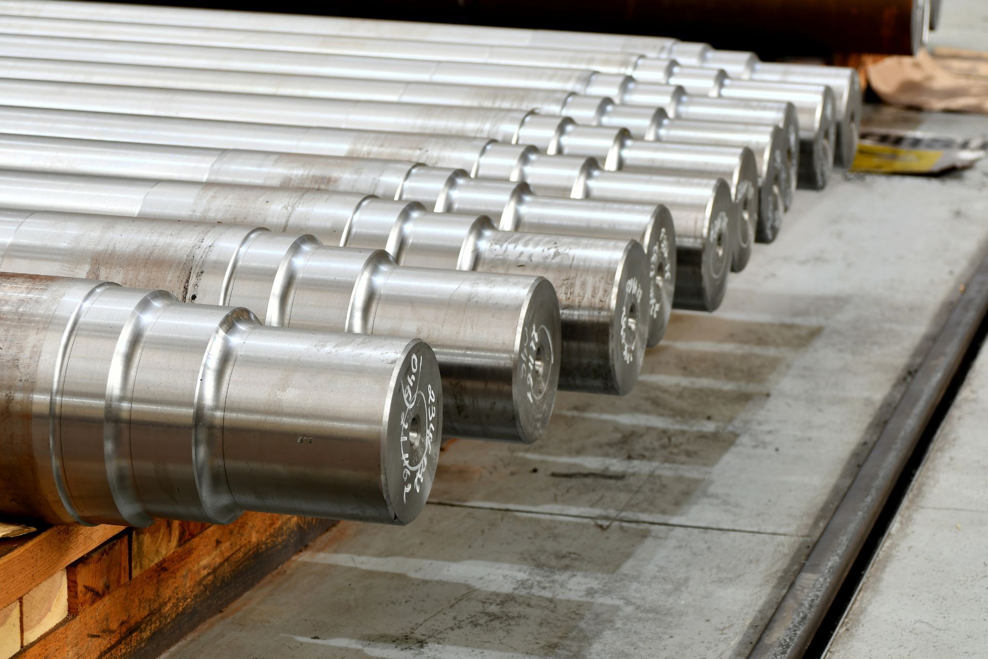 A bunch of metal pieces are stacked on top of each other on a table.
