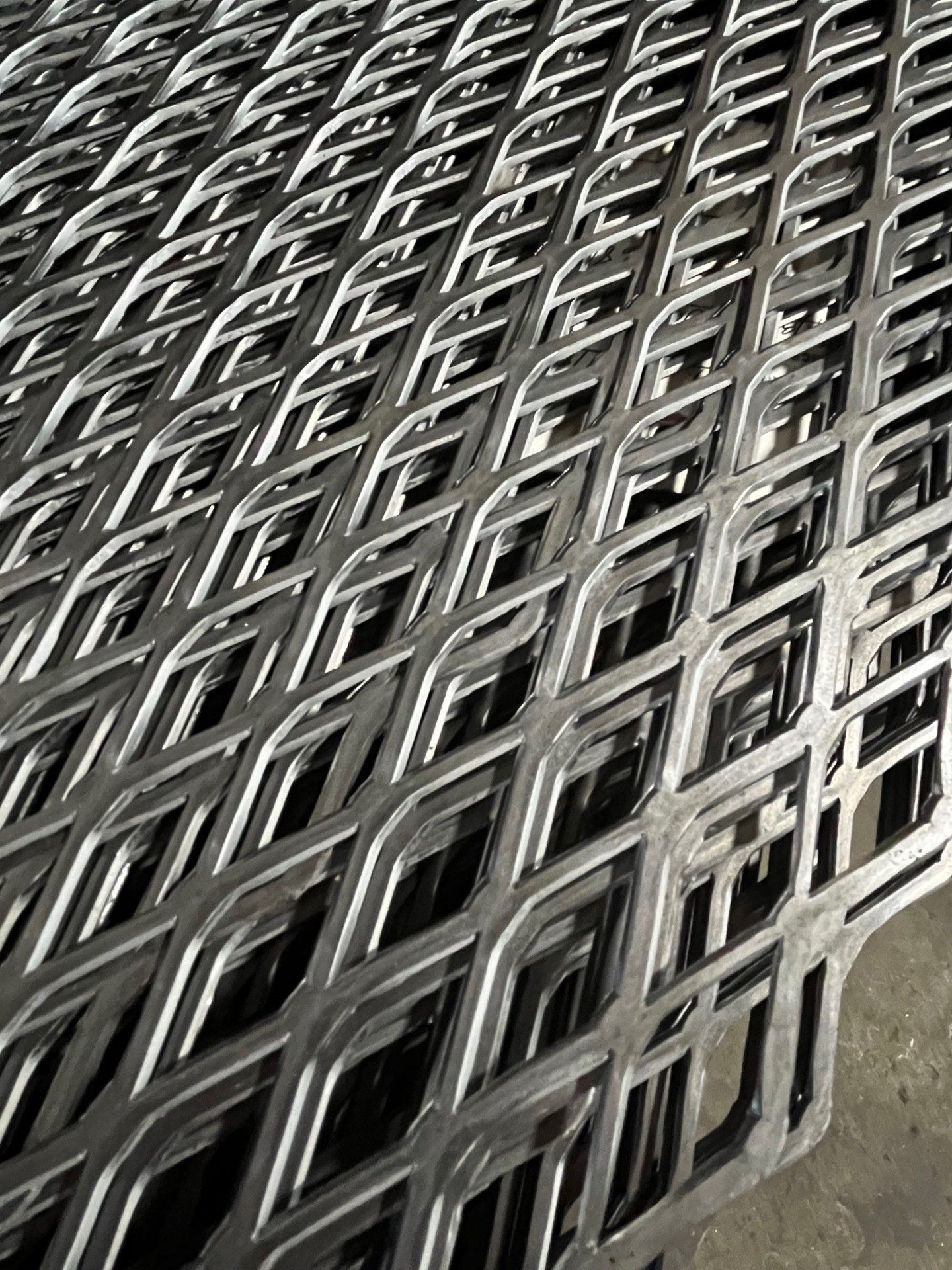 A bunch of metal pieces are stacked on top of each other on a table.