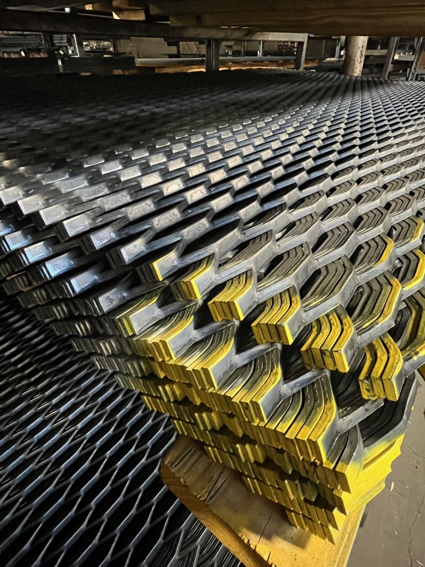 A bunch of metal pieces are stacked on top of each other on a table.