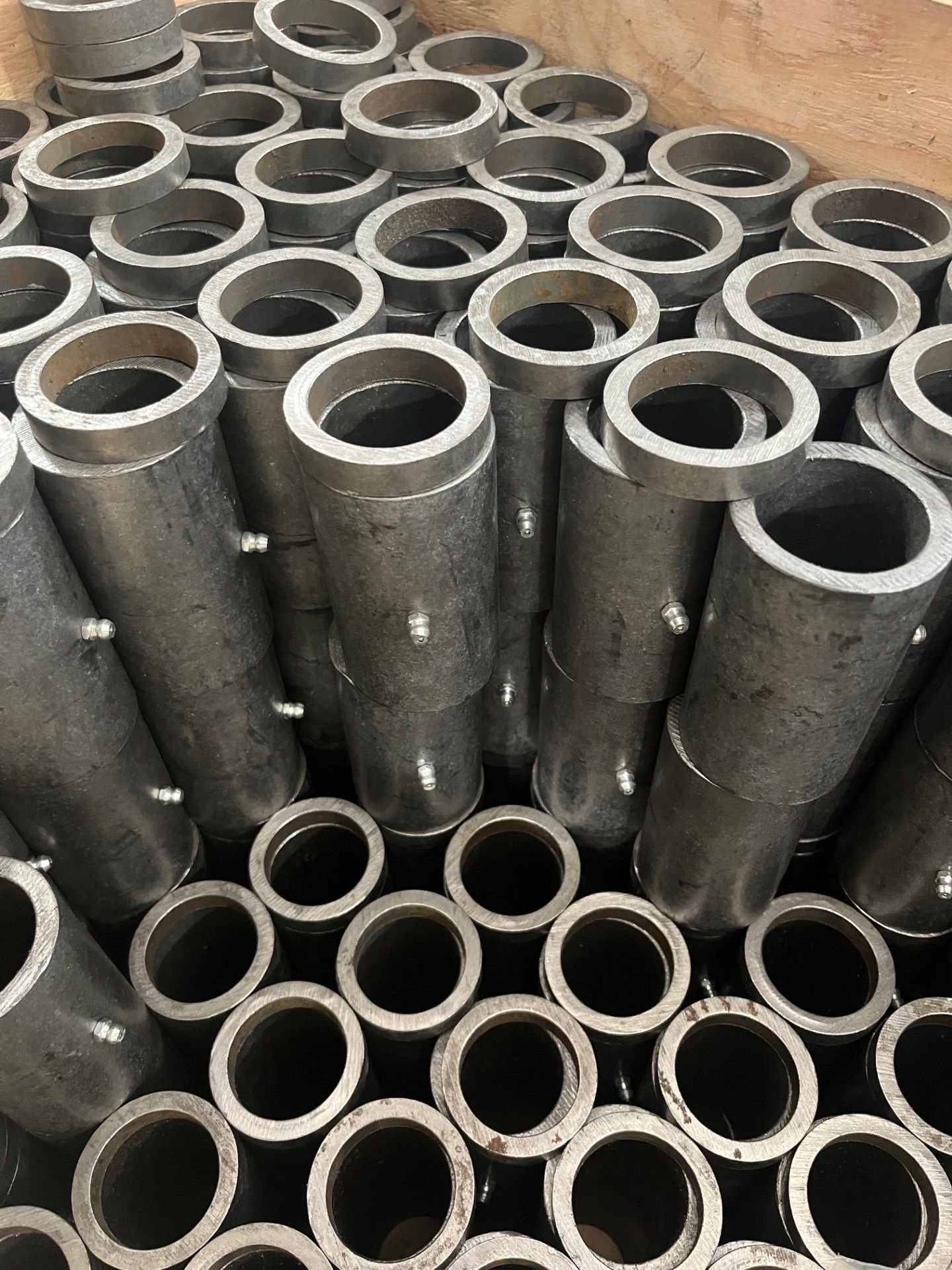 A bunch of metal pieces are stacked on top of each other on a table.