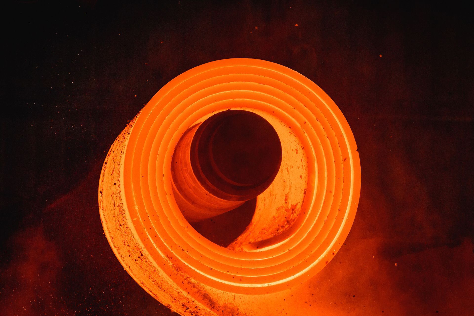 A bunch of metal pieces are stacked on top of each other on a table.