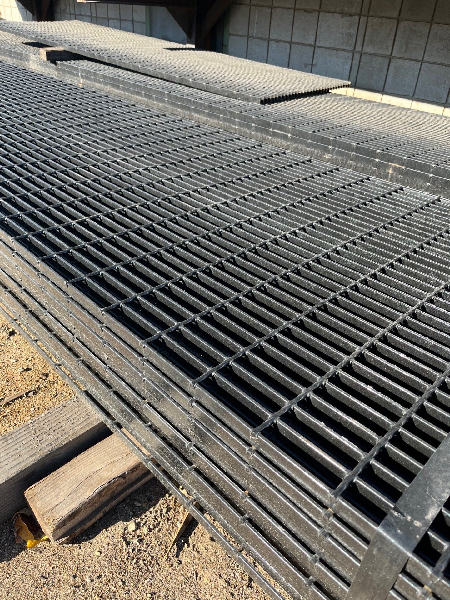 A bunch of metal pieces are stacked on top of each other on a table.