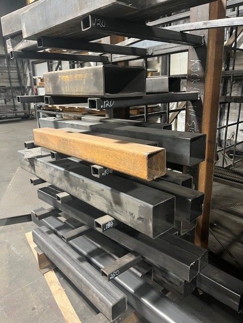 A bunch of metal pieces are stacked on top of each other on a table.