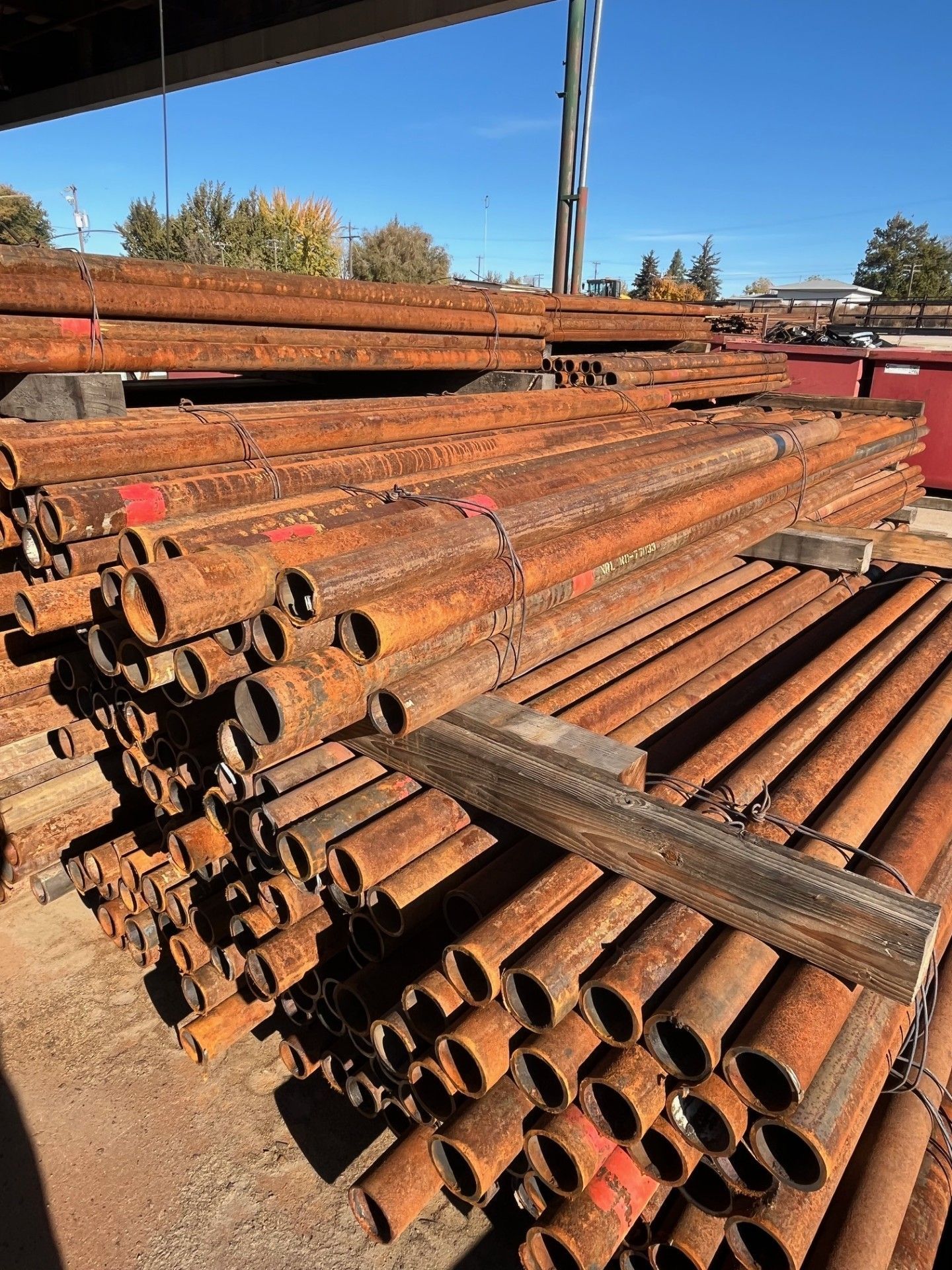 A bunch of metal pieces are stacked on top of each other on a table.
