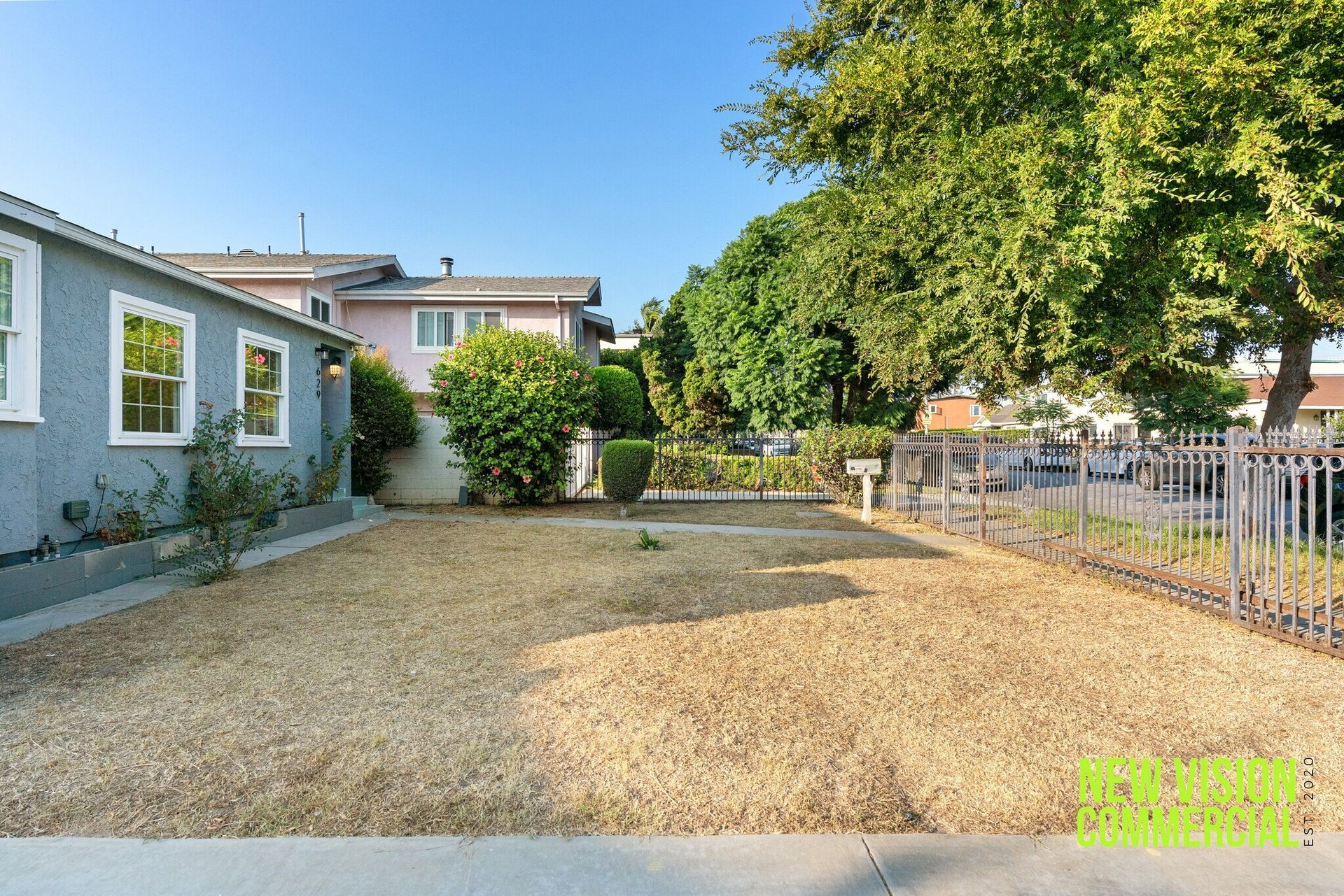 A house with a lot of gravel in front of it