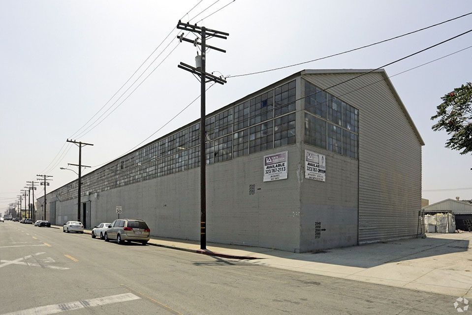 A large building with cars parked in front of it
