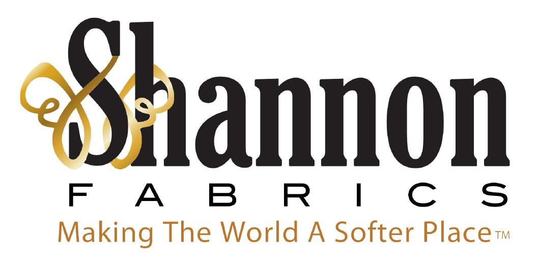 A logo for shannon fabrics making the world a softer place
