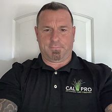 Man wearing black polo shirt with 