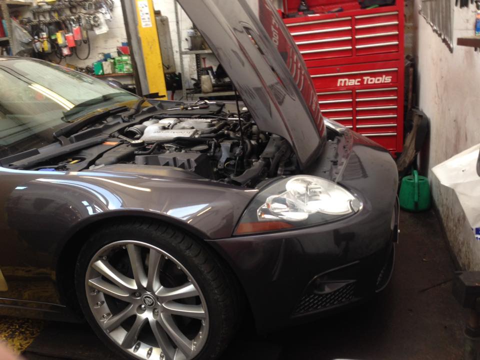 black car with open hood