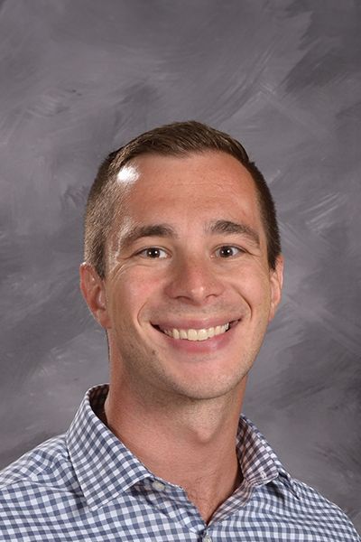 Head shot of Colin Paustian smiling at the camera
