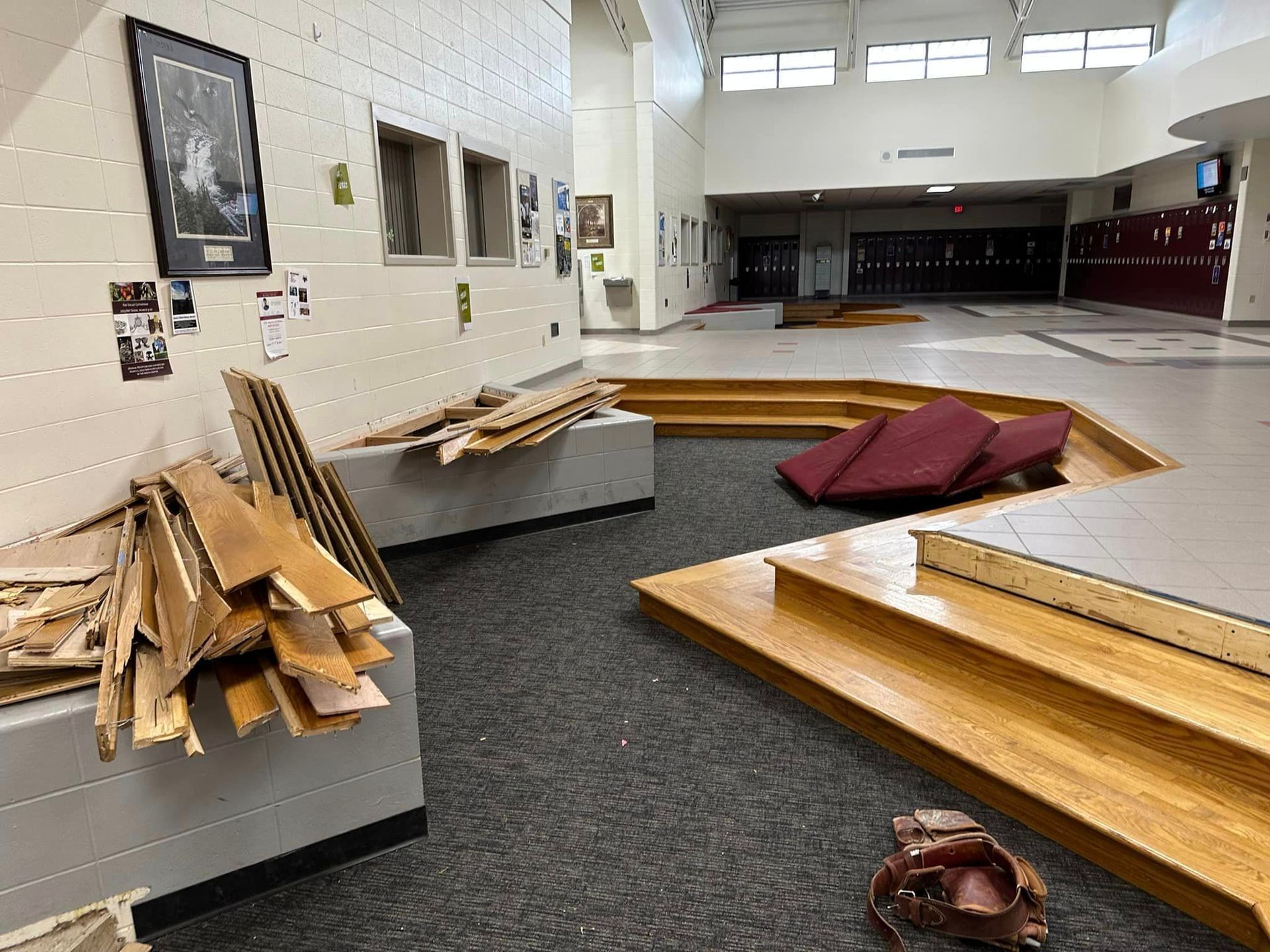 The pits with the wooden steps and cushions being removed