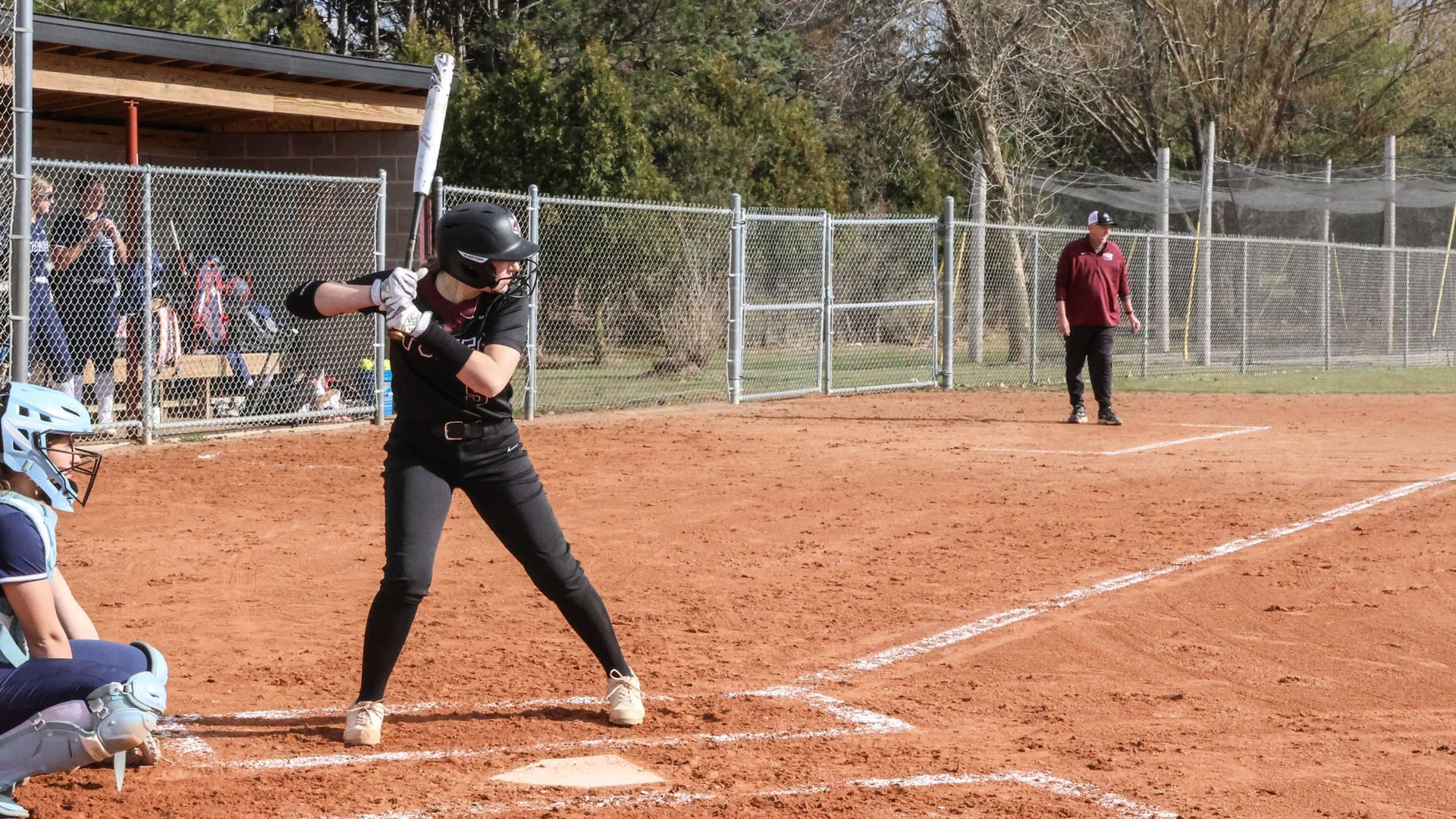 Softball team member up to bat