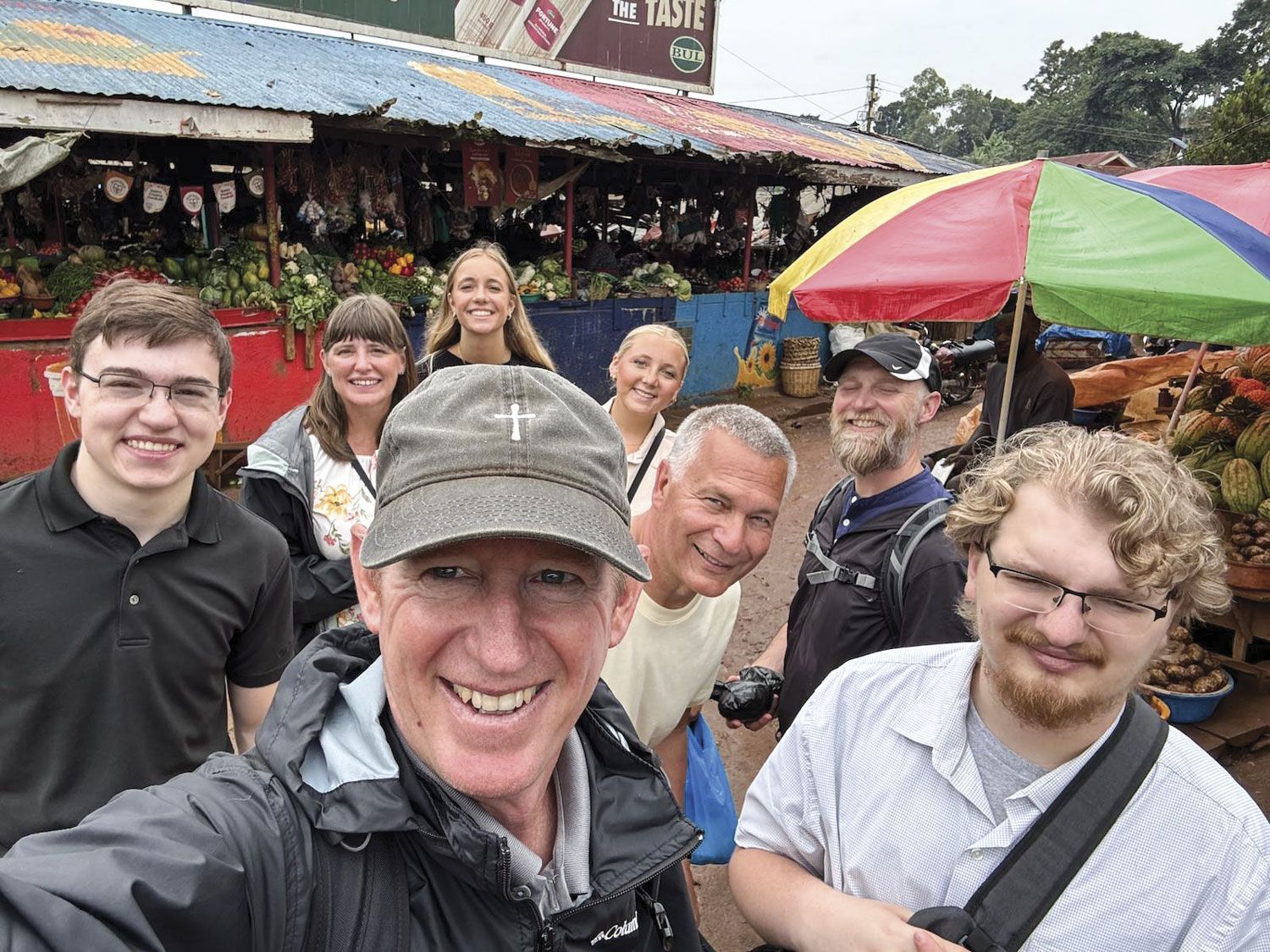 FVL students with local hosts at the market in Nigeria