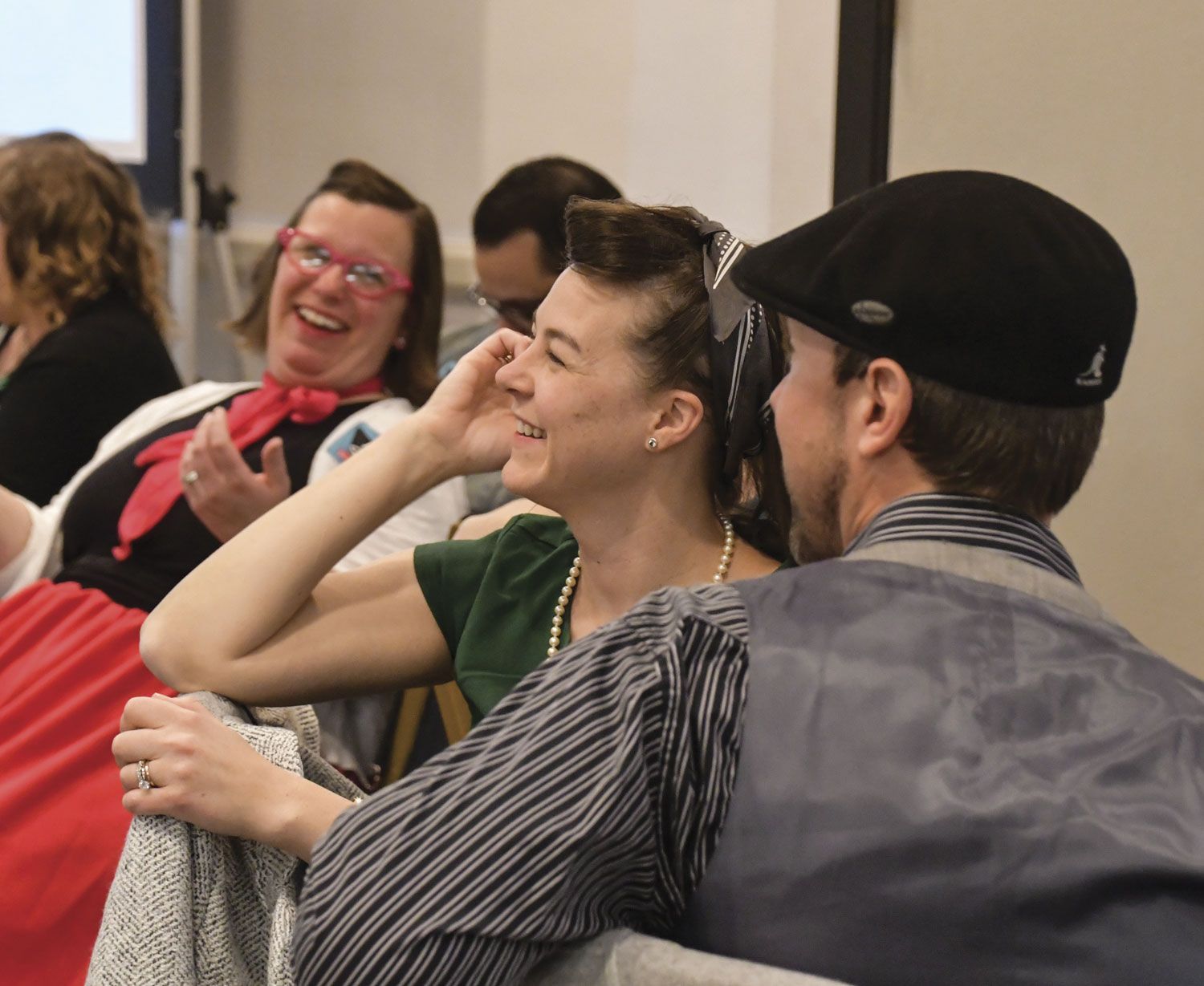 FoxFest attendees, sitting at their tables, laughing and having fun