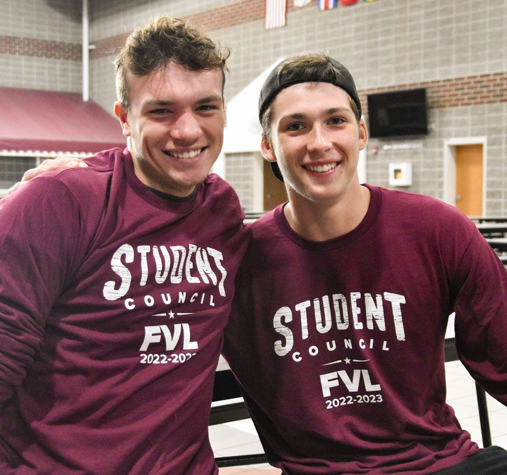 Two, smiling, male, FVL Student Council members in Commons
