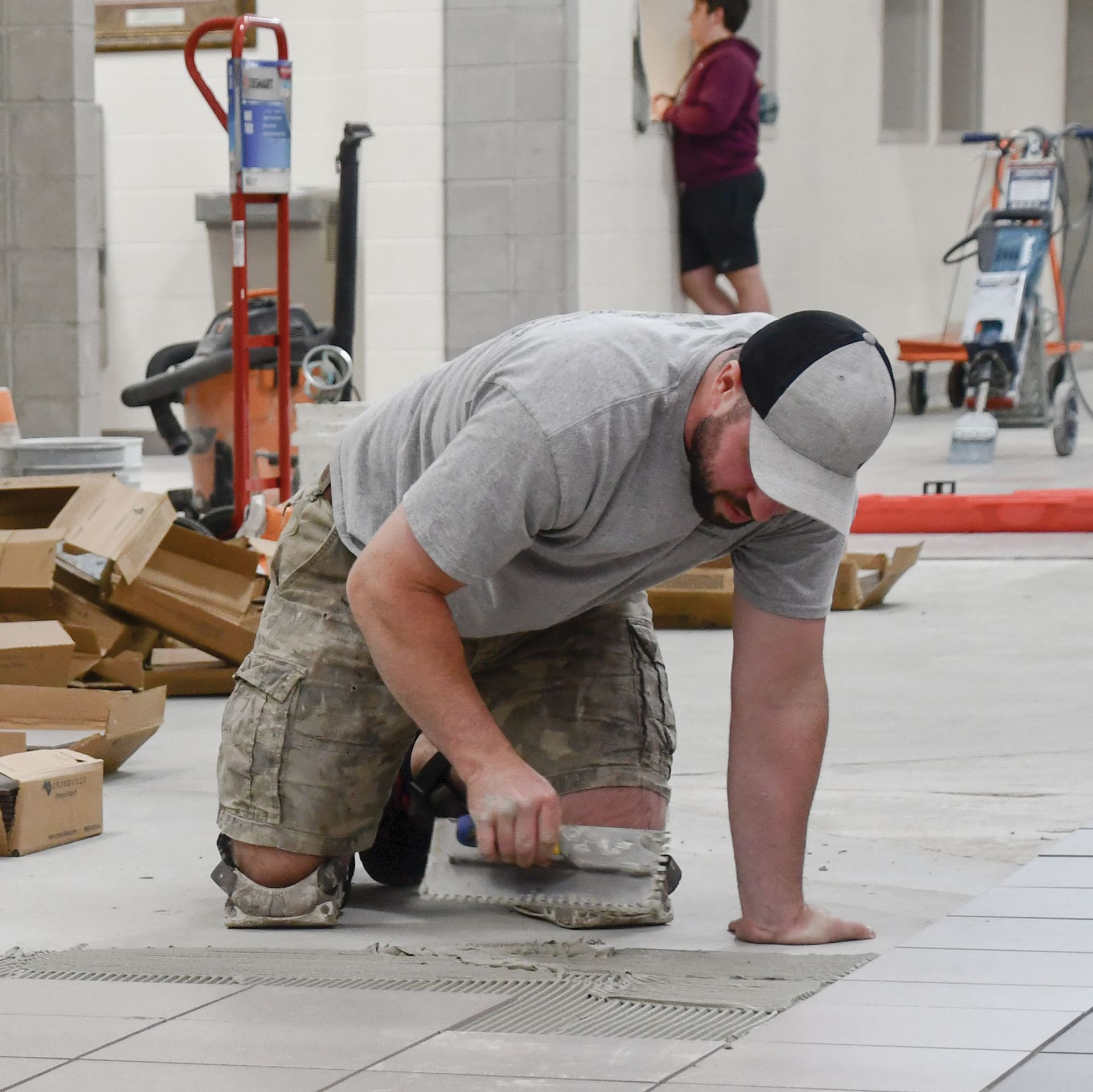 Former pits area being tiled in preparation for installation of lockers