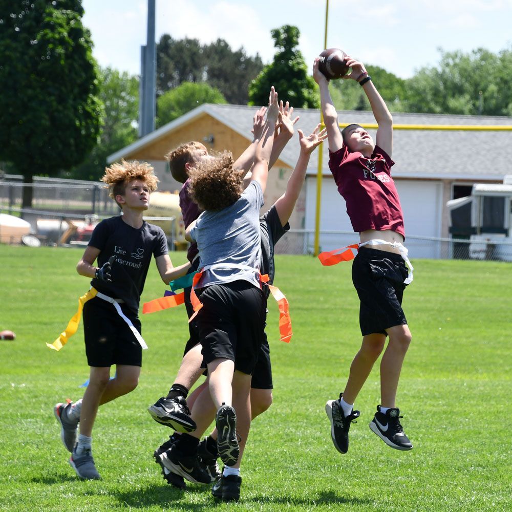 Group of young students playing flag football