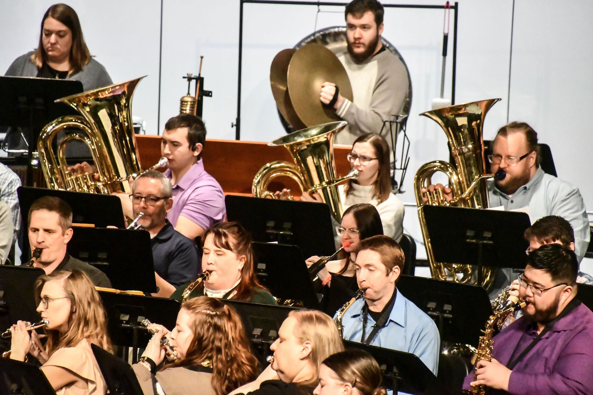 Alumni playing tuba, saxophone, cymbals