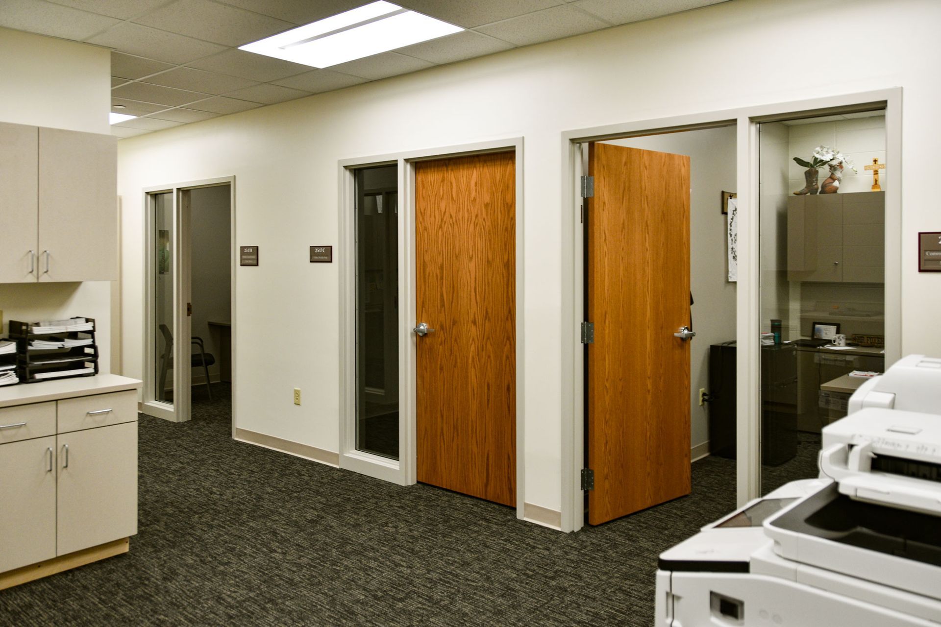 Three offices in the new Communications Suite along with the copier and counter and storage space