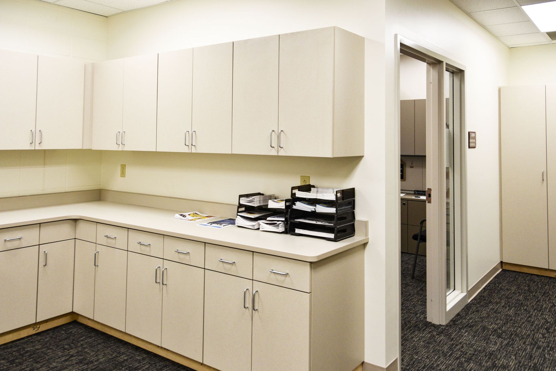 Counter, storage, and a doorway in the new Communications Suite