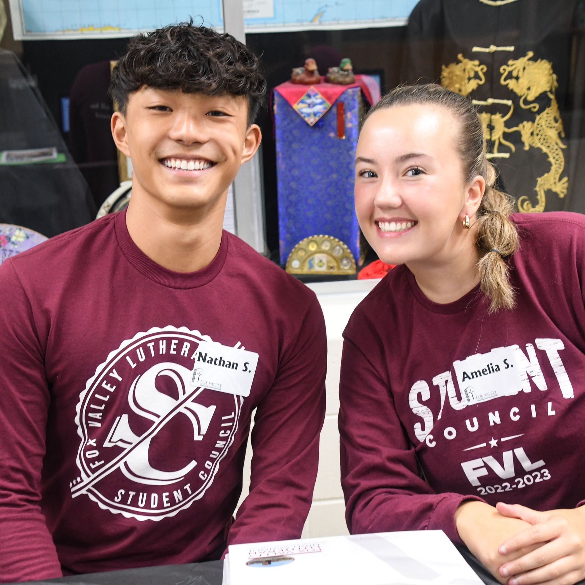 Guy and girl Student Council members smiling at the camera