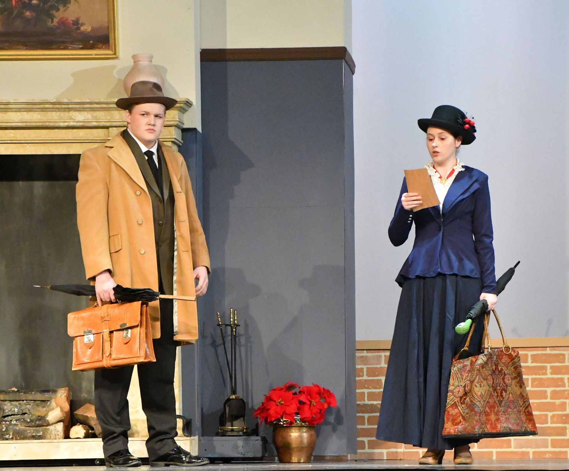 Mr. Banks and Mary Poppins standing near the fireplace.