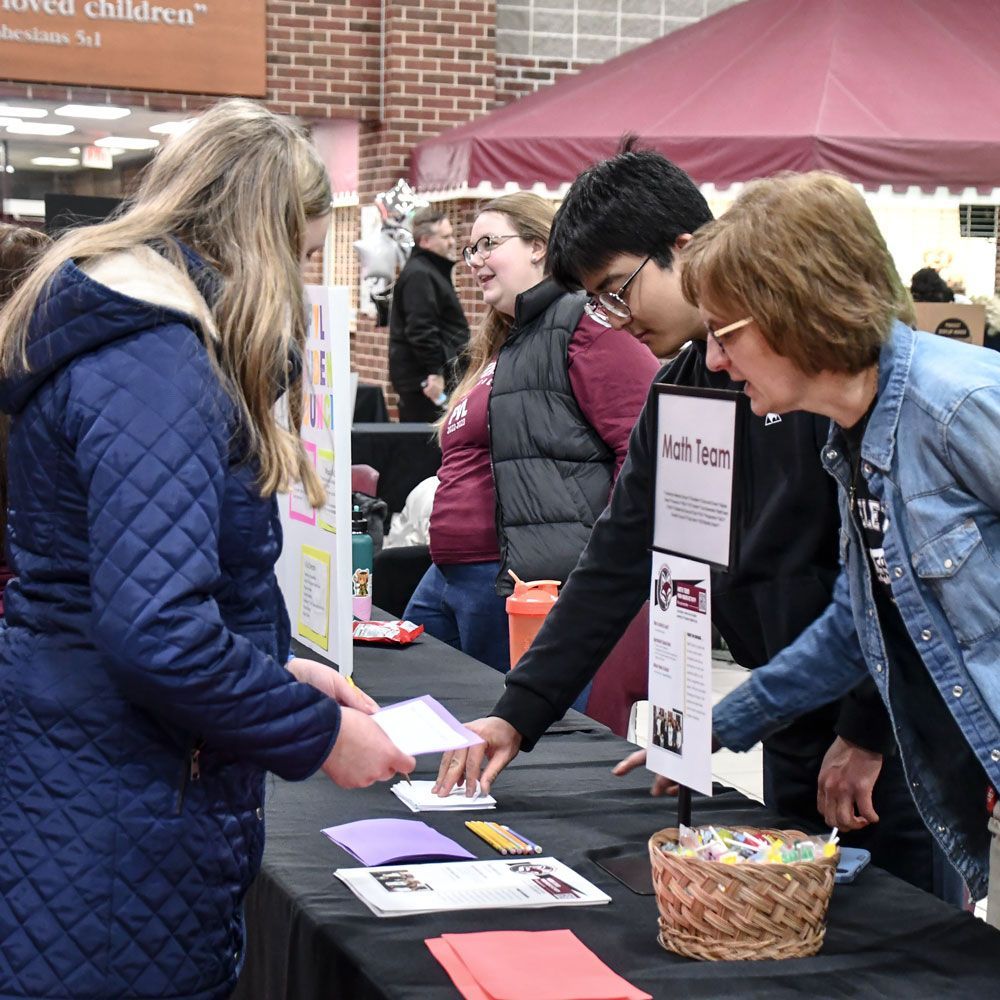Visitors talking to Mrs. Stern about the math team