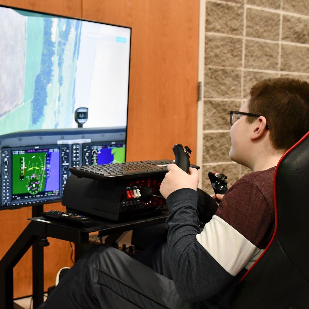 Visiting student using the flight simulator