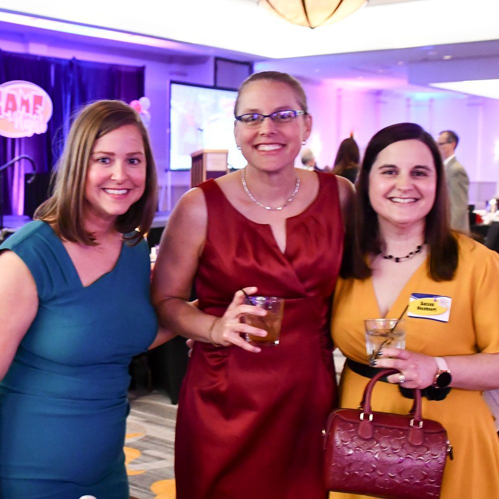 Three happy females having fun at a previous FoxFest event