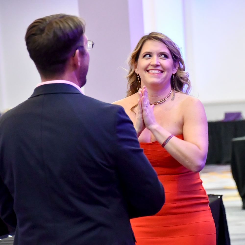 A happy woman playing a game at last year's event