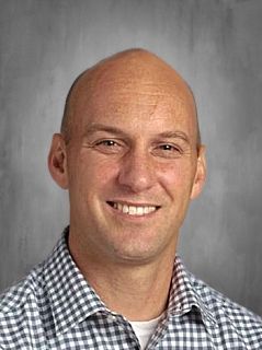 Head shot of Rev. Steve Lehmann smiling at the camera