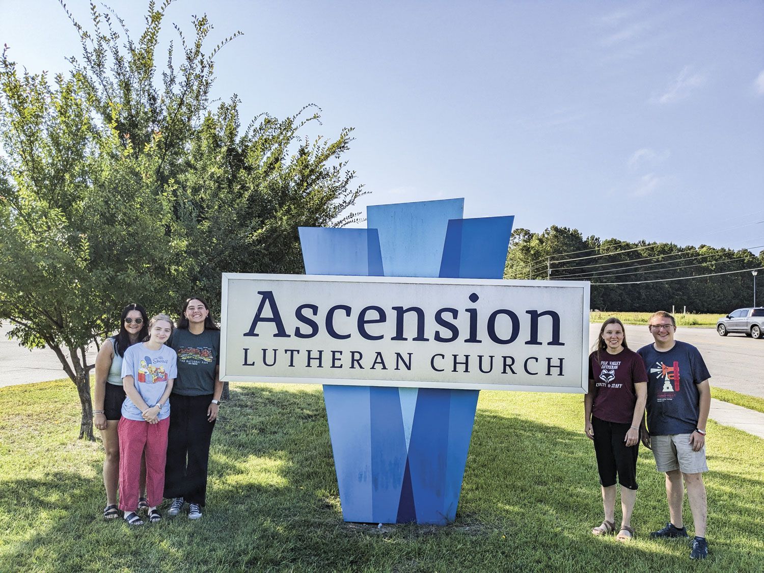 FVL students by the Ascension Lutheran Church sign, in North Carolina