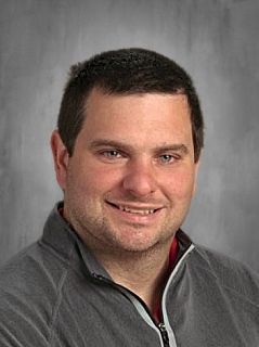 Head shot of Ben Perushek smiling at the camera