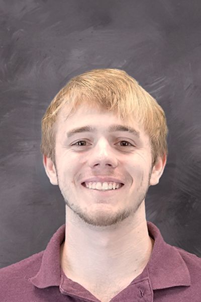 Head shot of smiling Liam Kopp smiling at the camera