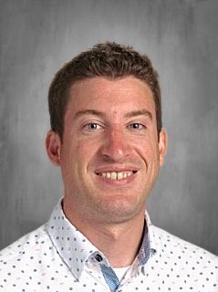 Head shot of Tommy Stelter smiling at the camera