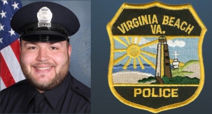 A virginia beach police officer is smiling in front of an american flag