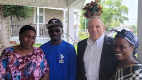 President Curtis DeBerg with the Gout family. 