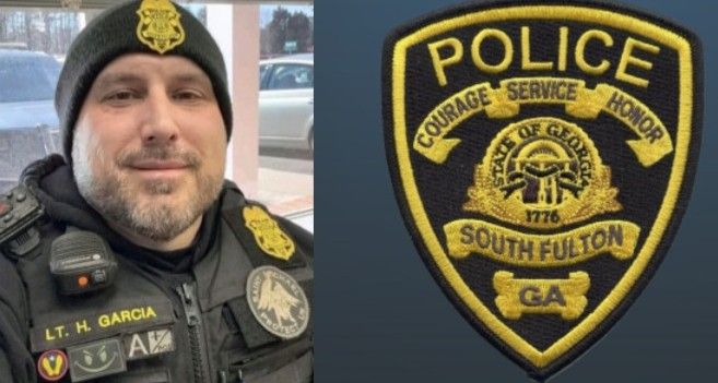 A man wearing a hat and a police badge