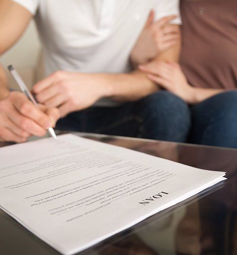 Couple Signing Mortgage Loan Agreement — Florence, AL — Quad Cities Financial