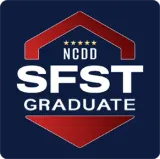 NCDD SFST Graduate logo in white and red on a dark blue background