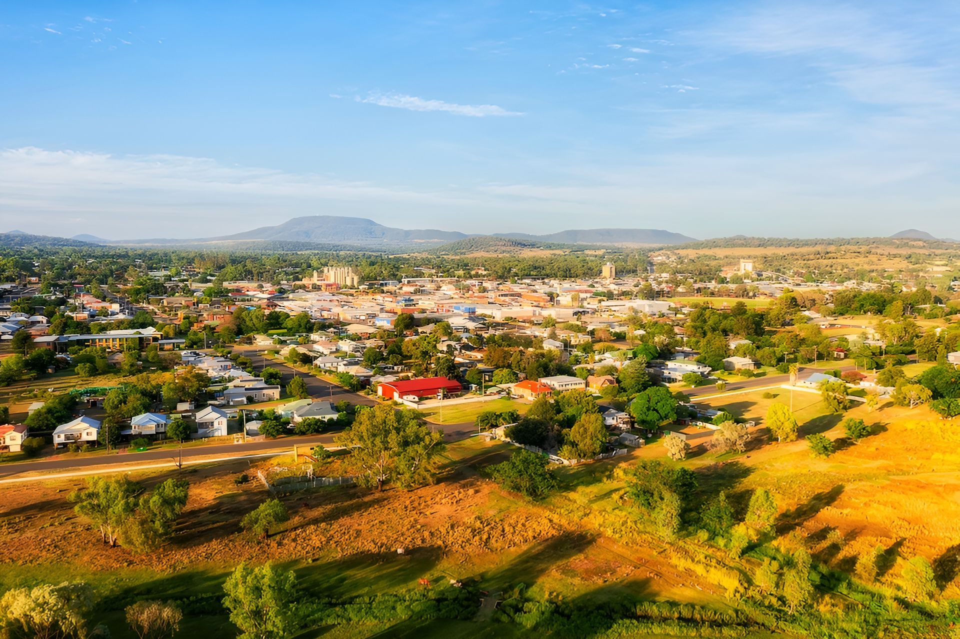 An Aerial View of a Small Town With Mountains in the Background — Tamworth Blinds & Awnings in Gunnedah, NSW