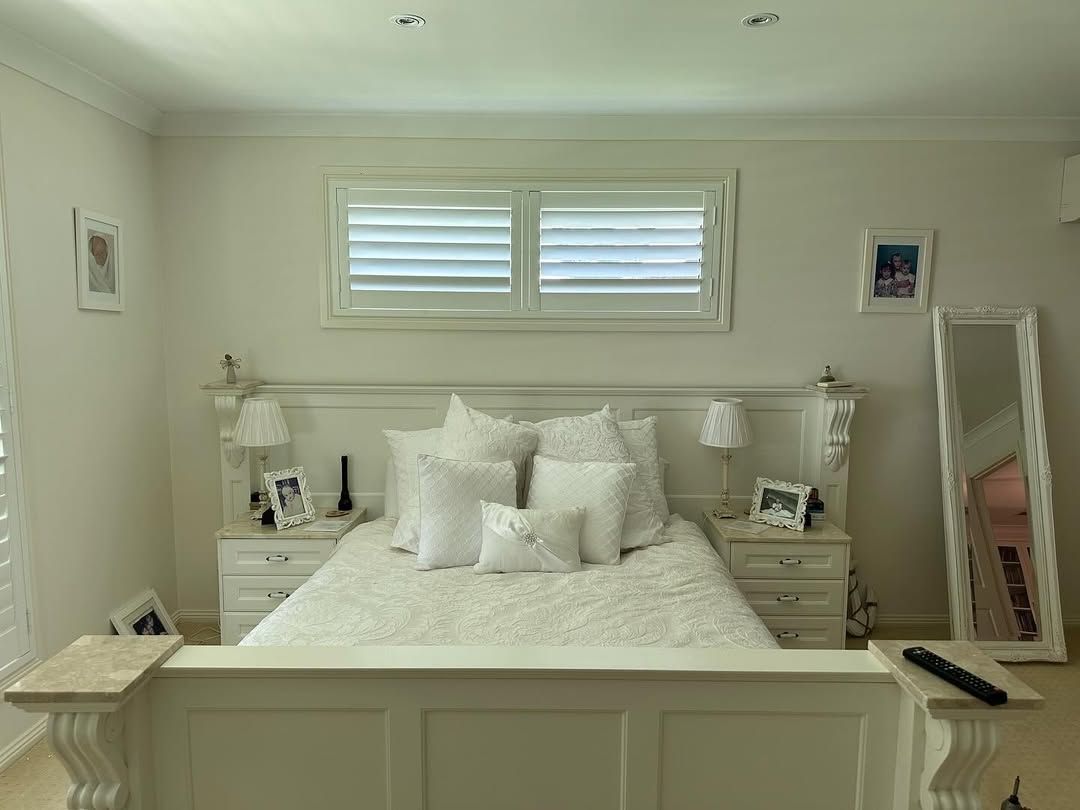 A Bedroom With a Small Shutters on the Windows — Tamworth Blinds & Awnings in Walcha, NSW