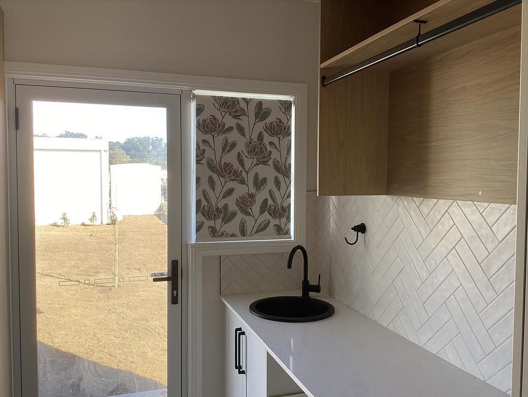 A Kitchen With a Sink and a Stylish Window Coverings and a Cabinet — Tamworth Blinds & Awnings in Tamworth, NSW
